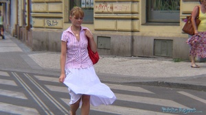 Blonde in pink shirt and white skirt sho - Picture 1