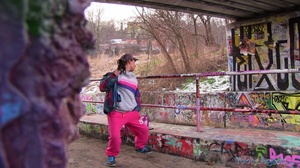 Brunette in face cap, pink pants, colorf - Picture 2