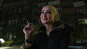 Tattooed smoking blonde in black coat an - Picture 3