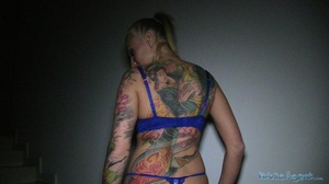 Tattooed smoking blonde in black coat an - Picture 4