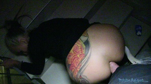 Tattooed smoking blonde in black coat an - Picture 14