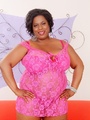 Tattooed big ebony in pink dress flaunts - Picture 1