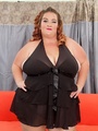 Chubby brunette in black dress flaunts - Picture 2