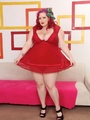 Big sexy redhead in red dress flaunts - Picture 1