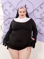 Chubby busty redhead dressed as nun - Picture 1