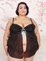 Tattooed chubby brunette in dark spotted - Picture 1