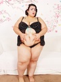 Tattooed chubby brunette in dark spotted - Picture 2
