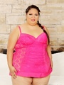 Plump brunette in pink dress drills - Picture 1