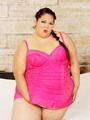 Plump brunette in pink dress drills - Picture 2