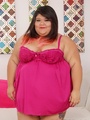 Chubby brunette in red negligee flaunts - Picture 1