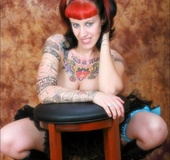 Gorgeous hottie in pigtails reveals her tattooed body and big hot boobs