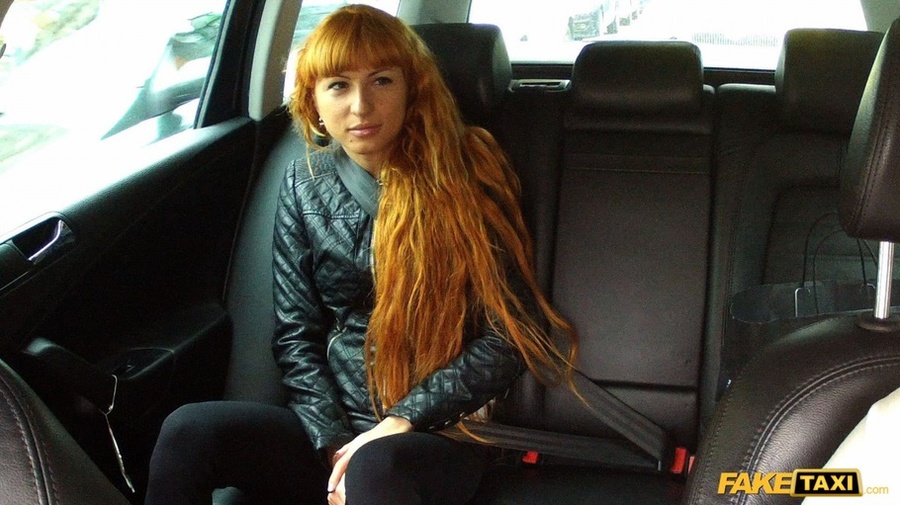 Cute redhead wearing black leather jacket lifts up her white shirt and gray bra and shows the driver her hot boobs then takes off her black pants and rubs her twat before she lets him bang her in different styles til her blows on her pussy in his fake taxi. - XXXonXXX - Pic 1