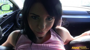 Beautiful babe sucks the driver's huge cock then takes off her gray cap, black and white jacket and pants and lets him fuck her in different positions in a fake taxi til he blows his spunk in her mouth wearing her pink shirt and bra. - Picture 10