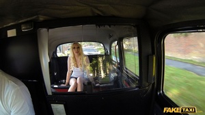 Blonde hottie displays her smoking hot body wearing her sunglasses, white shirt and jeans skirt in a fake taxi then opens her legs and teases the driver with her indulging pussy before she shows her big tits and sucks his dick then lets him fuck her different styles til he blows on her asshole. - Picture 2