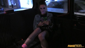 Luscious babe with stunning body wearing jeans jacket, black shirt, skirt and fishnet stockings rides on a fake taxi and teases the driver as she gets naked and sucks his huge cock then rubs it between her huge tits wearing her pink fishnet shirt before she lets him fuck her and lets him blow jizz in her mouth. - Picture 1