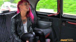 Tattooed babe with purple hair displays her foxy body in a fake taxi wearing her black leather jacket, pants and white shirt before she gets naked and sucks the driver's dick then lets him bang her in multiple styles til he fills her mouth with warm spunk. - Picture 1