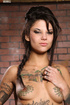Tattooed babe gets tied on a brown chair then blindfolded, breasts clipped