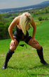 Two blonde girls make out and strip in the open countryside.