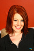 redhead girl seductively takes