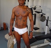 Tatted up black man uses a cock ring while he jerks off.