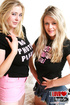 Two sexy blondes love to grab each other’s giant breasts.