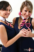 Slutty girls get undresses after class and pinch each other’s nipples.