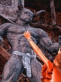 Brunette brings a minotaur statue to - Picture 1