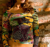 Lively sexy brunette in tight colorful dress shows pointy tits and curves