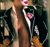 Seriously sexy blonde clown shows bouncy tits and curvy booty indoors