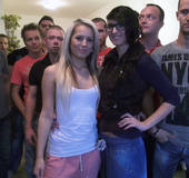 Blonde is surrounded by twenty guys in gangbang fuck action
