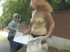 Plump and slender blonde got her dress jerked down outdoors on sidewalk