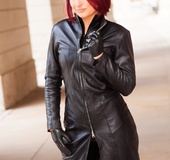 Hot redhead in sexy tight black latex and leather coat models hot body