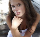 Elegant outdoor set with an innocent young brunette
