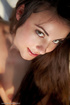Sexy smiling brunette spreads her awesome long legs