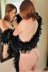 Nude redhead plays with her mirror reflection flaunting curvy ass and
