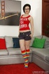 Short-haired brunette in rainbow knee-highed socks gets fucked on a grey