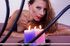 Skinny brunette in lingerie drips wax on her ass in the bed.