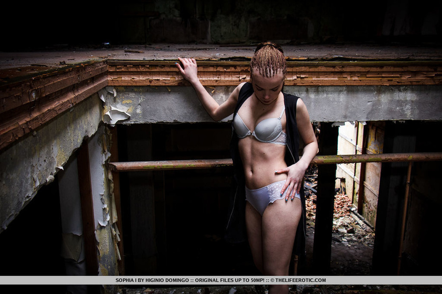 Babe with braided hair strips in a warehous - XXX Dessert - Picture 4
