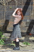 Kinky redhead strips and plays with her cunt outdoors.
