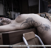 Exotic chick in black plays with herself in the backroom.