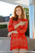 Brunette girl in red lace dress exposes pussy on dining table.