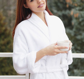 Redhead showcases her smooth pussy on her bathtub right before bath.