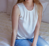 Sweet simple blonde babe poses with flowers then gets naked on bed.