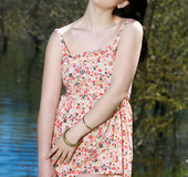 Pretty ivory-skinned girl enjoys the nature and sexily strips.