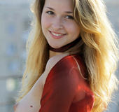 Seductive blondie in red top and flowing wrap skirt shows tits and booty