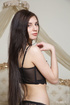 Slim dark hair hottie in black lingerie models soft tits and shaved cunt