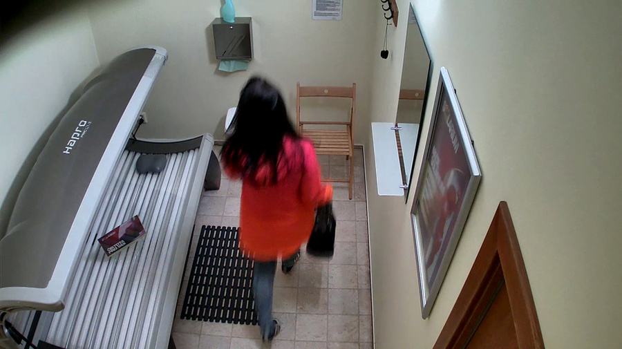 Tanned brunette with enhanced tits is lying in solarium - XXXonXXX - Pic 1