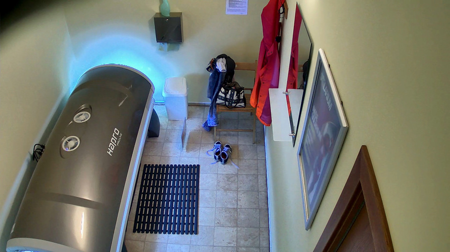 Tanned brunette with enhanced tits is lying in solarium - XXXonXXX - Pic 5