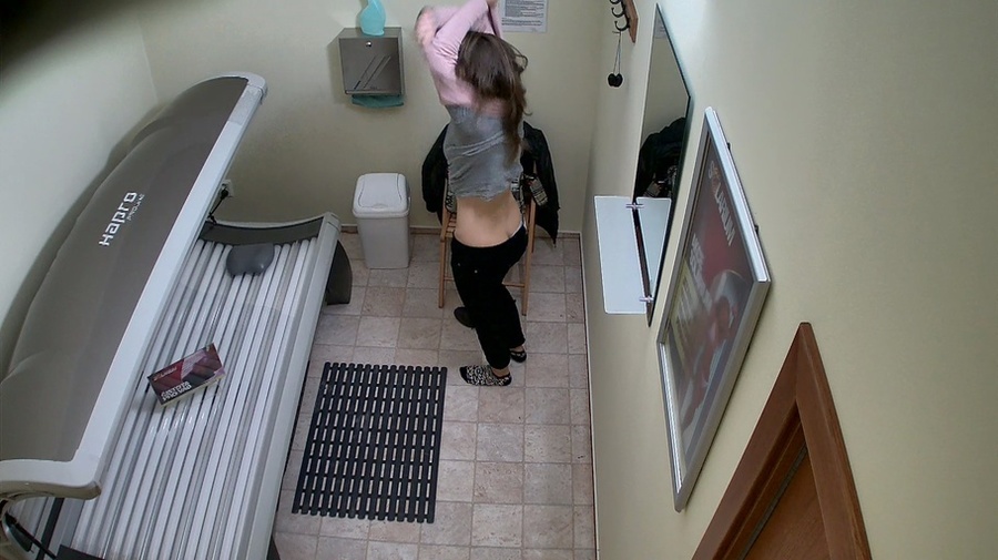 Dressed in black brown-haired girl in solarium - XXXonXXX - Pic 1