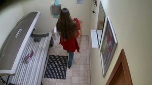 Leggy brunette in tight jeans undresses her red coat - Picture 1